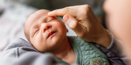 Little baby boy enjoying in mother's touch