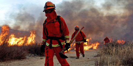Inmate firefighters work as the Hughes Fire burns north of Los Angeles 