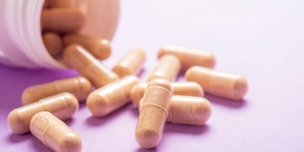 Nutritional supplement on a purple background.