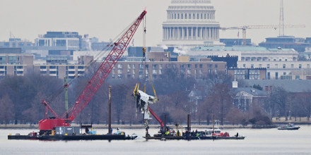 A crane removes airplane wreckage from the Potomac River on Feb. 3, 2025.