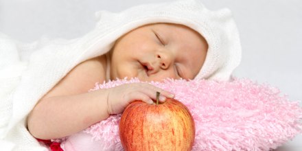 Baby with apple