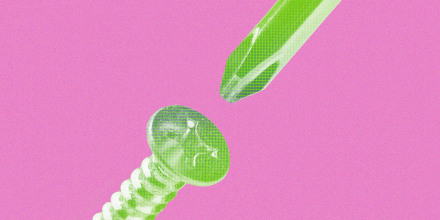 Up-close photo of a screwdriver head about to fit into a nail head, filled with a green gradient overlay and against a pink background.