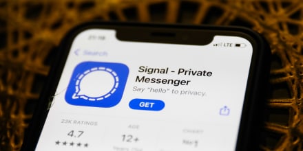 Signal logo on the App Store is seen displayed on a phone screen