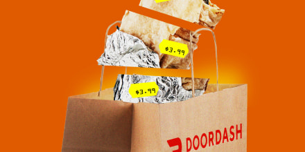 A cut up burrito with several price tags in a DoorDash bag.