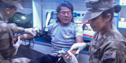 This handout picture released Saturday by the Peruvian Navy shows Peruvian fisherman Maximo Napa, 61, receiving medical attention upon his arrival in Paita, Piura department, Peru. 