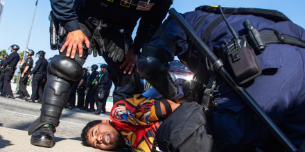 California Highway Patrol officers arrest a demonstrator