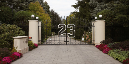 A gate with the number 23 seen outside