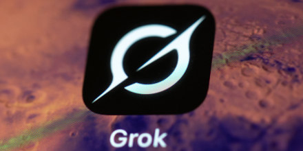 The Grok app logo displayed on a smartphone