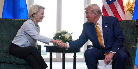President Donald Trump and European Commission President Ursula von der Leyen shake hands.