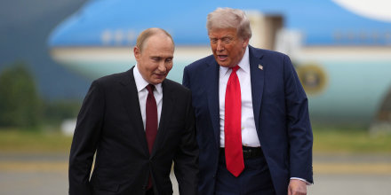 President Donald Trump walks with Russian President Vladimir Putin at Joint Base Elmendorf-Richardson in Anchorage, Alaska.