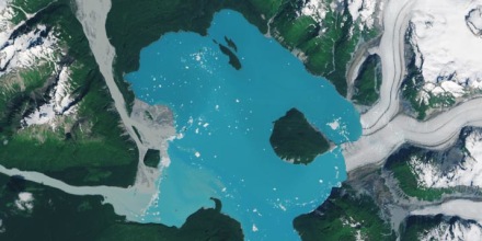 A landmass that was once encased in the ice of the Alsek Glacier is now surrounded by water.