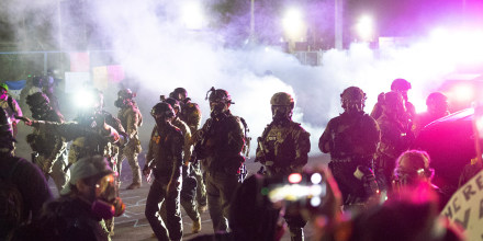 Federal law enforcement agents use tear gas and pepper balls during a protest outside an immigrant processing center on Sept. 27, 2025 in Broadview, Ill. 