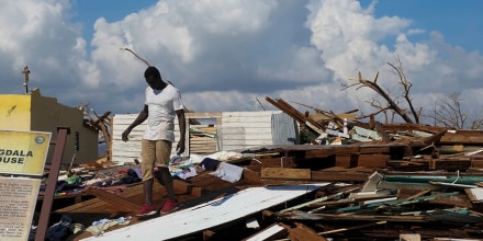 A man looks for salvageable items in the aftermath of Hurricane Melissa in Black River, Jamaica, Thursday, Oct. 30, 2025.