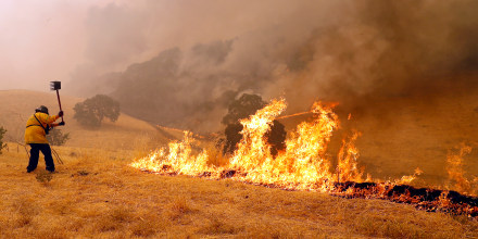 Benicia Fire Department firefighter Kyle Williams keep flames at bay.