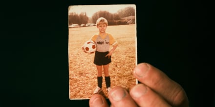 Chris Woods Sr. holds a childhood photo of himself.