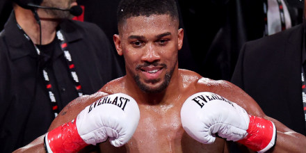 Anthony Joshua celebrates victory.