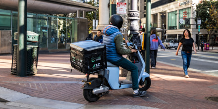 Motor Scooter On Sidewalk