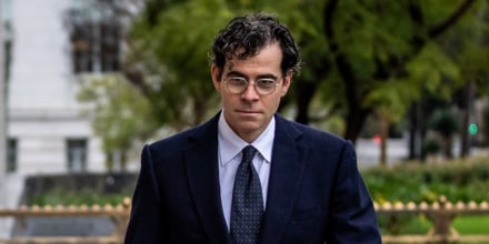 Adam Mosseri, right, walks outside next to a woman