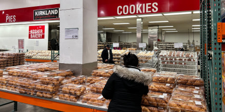 Woman selecting Croissants (recently recalled) from Costco bakery department, Queens, New York