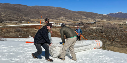 Soldier Hollow Nordic Center staa roll out Snow Secure as part of the snow preservation process.