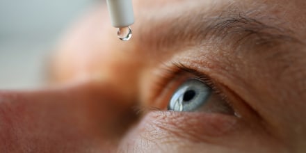 Man drops eye drops install lenses, moisturizing