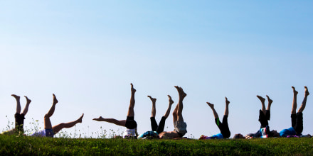 Yoga students point their toes skyward during a weekly session at Kettle Cove. The donation-based classes are held on Fridays at 8 a.m. The donations are split between Kettle Cove State Park and South Portland-based nonprofit group Cultivating Balance, teacher Melora Gregory said.