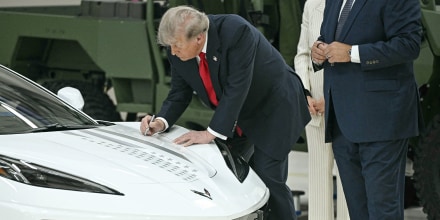 President Donald Trump signs a Corvette as he tours General Motors' Milford Proving Ground in Milford, Mich., on July 27, 2026. 