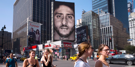 Image: People walk by a Nike advertisement featuring Colin Kaepernick on display on Sept. 6, 2018, in New York