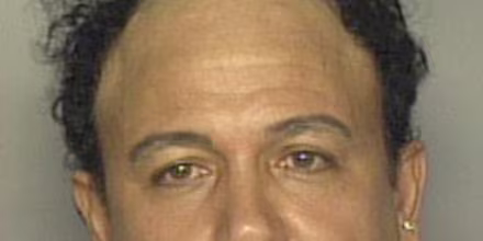 The 2002 mug shot of Caesar Syoc when he made a bomb threat, in Miami.