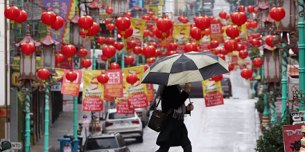 Image: Woman carries umbrella in San Franisco, Chinatown