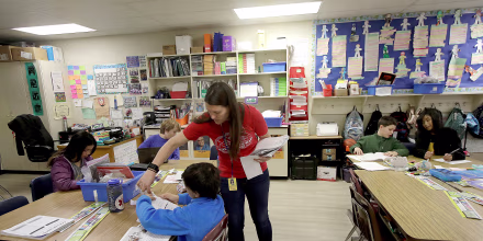 Laura Shield, a fourth grade teacher at Chabot Elementary School in Oakland, California, with a student in March. 