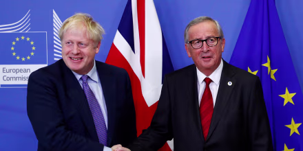Image: European Commission President Jean-Claude Juncker and Britain's Prime Minister Boris Johnson shake hands during a news conference after agreeing on the Brexit deal