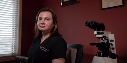Allison Brown, a dermatologist and dermatopathologist, in her home office in Novi, Mich.