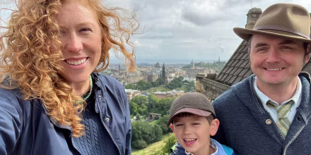 Kinsey Gidick taking a selfie with her son and husband