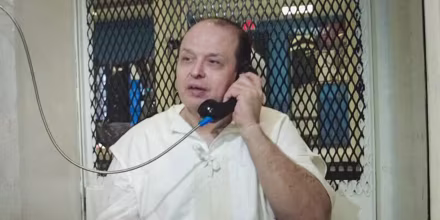 Robert Roberson speaks on the phone in jail