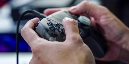 A person plays with the console.