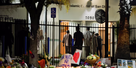 People take part in an early morning call to prayer at the Islamic Center of San Diego