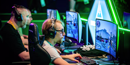 Visitors play video-games on computers.