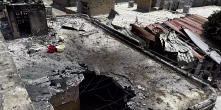 A destroyed rooftop is seen in an aerial view