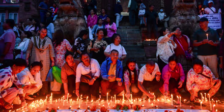 People light candles at Basantapur Durbar Square in Kathmandu, Nepal, on September 7, 2026, to honor those who lost their lives in the Bhote Koshi River floods and landslides in Rasuwa and other affected areas, as Nepal observes a national day of mourning declared by the government of Nepal. 