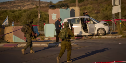 Israeli security forces inspect the scene.