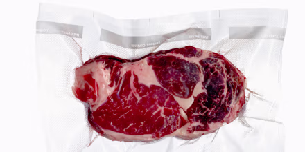 Vacuum sealed frozen cut of beef