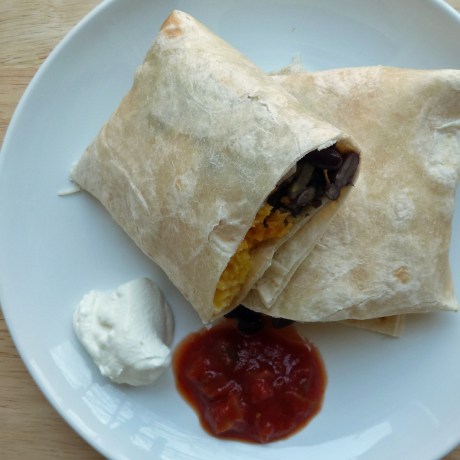 Freezer breakfast burrito (plated with salsa and sour cream)