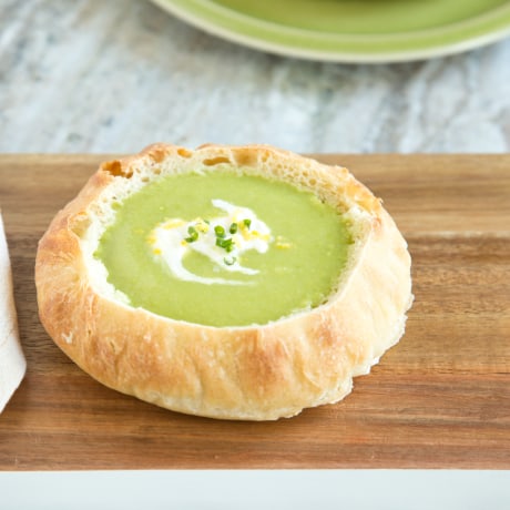 Vegetarian spring pea soup in a bread bowl