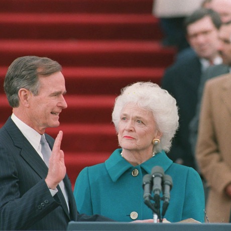 Image:  First lady Barbara Bush holds the bible for her husband George Bush as he is sworn into office