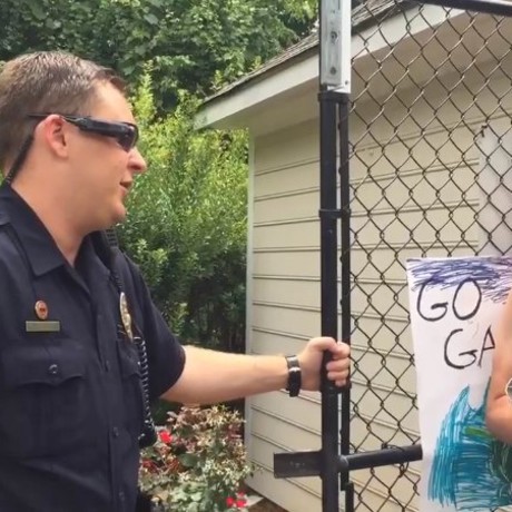 Adam Bloom talks to police at a pool in Winston-Salem, North Carolina.