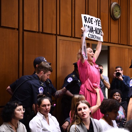 Image: A member of Code Pink protests as Supreme Court nominee Brett Kavanaugh arrives