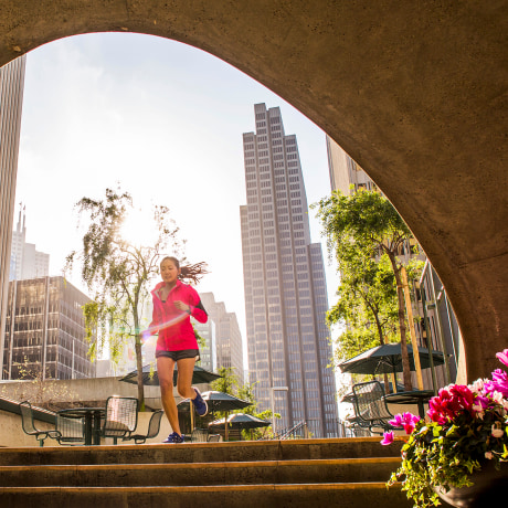 Woman running in urban park