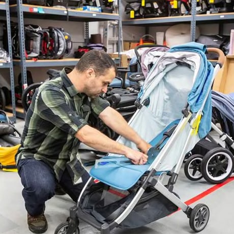 CR test engineer Adam Nappi measures how far a stroller seat reclines to determine whether it's suitable for an infant.