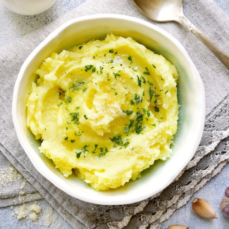 Potato mash with olive oil,parmesan cheese and greens